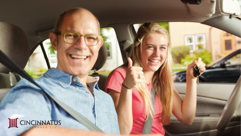 Father sits with his daughter in the passenger seat of a car. Preparing for your child to be a youthful driver takes patience and planning!